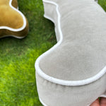 Thumbnail for Close-up of hand-embroidered dog name on velvet bone pillow
