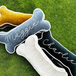 Thumbnail for Personalized dog bone pillow shown with a pet dog for size reference