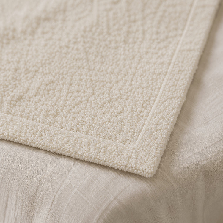 Close-up of Ivory Bouclé texture and finished edge