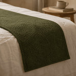 Thumbnail for Close view of Moss Green Bouclé bed runner draped over the side of a bed