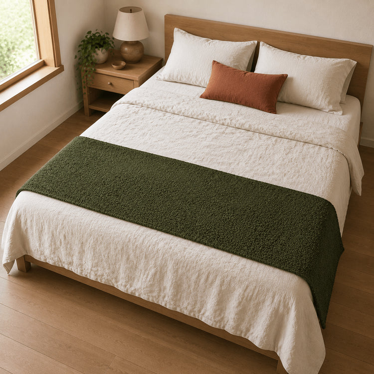 Moss Green Bouclé bed runner viewed from above on a neutral bed