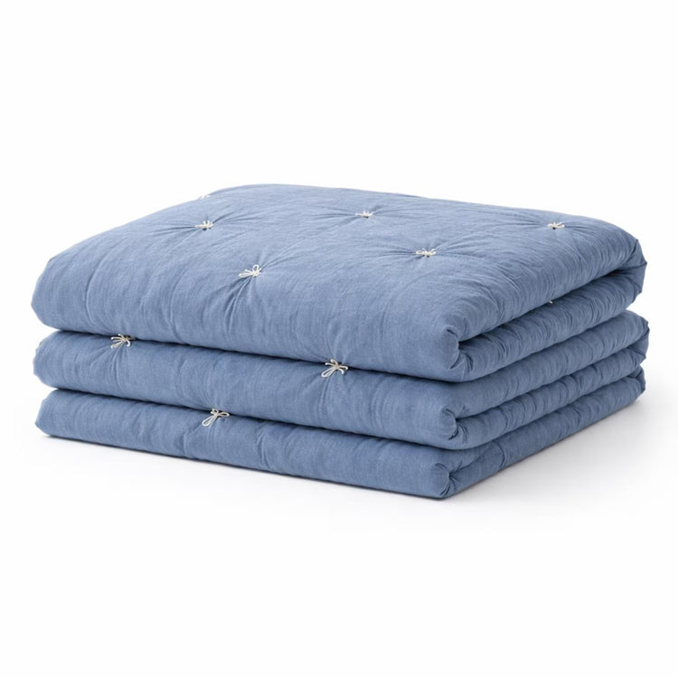 Handmade Cotton Velvet Quilt in Smoke Blue, folded showing hand-tufted diamond pattern